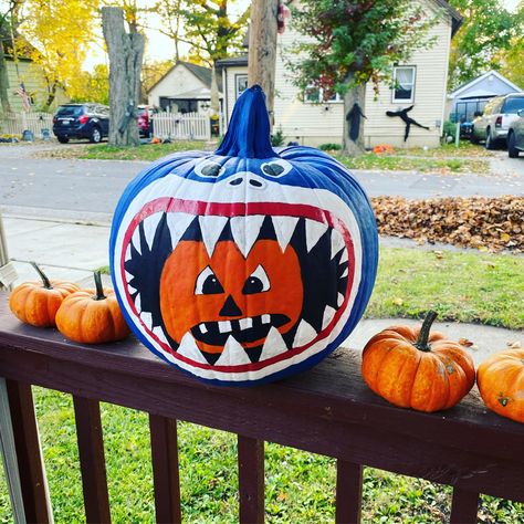 Shark eating pumpkin painted on a pumpkin Shark Pumpkin Painted, Baby Shark Pumpkin, Shark Pumpkin, Pumpkin Painting Halloween, Pumpkin Competition, Storybook Pumpkin, Shark Eating, Pumpkin Designs Painted, Pirate Pumpkin