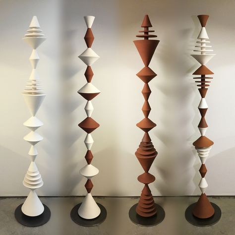 These ceramic sculptures are composed from modular handmade pieces. With a nod to mid-century modern, the geometric forms repeat playfully, complementing both plants and architecture. The unglazed stoneware echoes the color palette of terra-cotta planters. Mid Century Wood, Totem Poles, Turning Projects, Geometric Forms, Terracotta Planter, Wood Turning Projects, Geometric Form, Embroidery Blouse Designs, Wall Sculpture