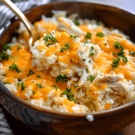 Creamy crockpot cheesy chicken and rice, an easy and comforting meal perfect for busy weeknights. Just set it and forget it! Crockpot Recipes Chicken And Rice, Crockpot Cheesy Chicken And Rice, Baked Potato Bar Toppings, Potato Bar Toppings, Cheesy Crockpot Chicken, Crockpot Cheesy Chicken, Crockpot Chicken And Rice, Rice Crockpot, Warm Dip Recipes