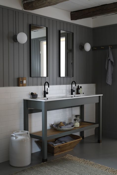 These Italian sinks with Dornbracht Tara faucets are set in a Kvänum vanity with slatted storage. They are the perfect bathroom faucets and fixtures for the newly married couple designing their first home or the seasoned married couple settling into their remodeled forever home. Plus, this paneled, shades-of-gray design is the work of Kvänum of West Gotland, Sweden, specialists in traditional millwork and an official supplier to the Swedish Royal Court. Dream Dressing Room, Luxe Kitchen, Clothes Cabinet, Kitchen Guide, Dressing Rooms, Dressing Area, Dark Interiors, Bathroom Wall Tile, Double Sink