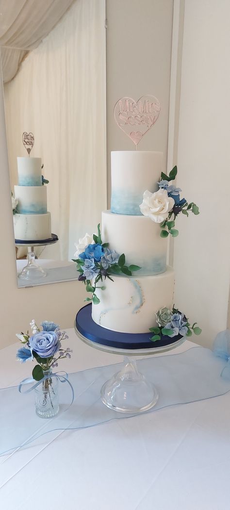 Blue, roses, poppies, hydrangea , sea thistle  all in sugar.  Marbling, watercolour tall and elegant Dusty Blue Simple Wedding Cake, Wedding Cake Designs 2 Tier Blue, 2 Tier Elegant Wedding Cake, Simple Dusty Blue Wedding Cake, 3 Tier Wedding Cake Dusty Blue, Watercolour Wedding Cake, White Blue Wedding Cake, Ube Wedding Cake, Wedding Cake 2 Tier Blue