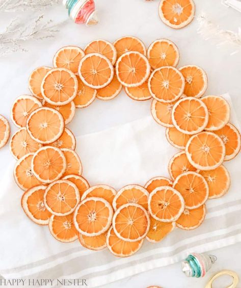 I've always wanted to make a Christmas wreath with orange slices, and I finally did it. This DIY will show how simple it is to dry the oranges in the oven. Make this beautiful dried orange slices wreath to hang on your front door or wall for the holidays. A gorgeous warm citrus wreath brings the perfect touch of holiday cheer. Dried Fruit Decorations, Citrus Wreath, Kids Christmas Decorations, Make A Christmas Wreath, Mantle Decorating Ideas, Wreaths For Christmas, Handmade Christmas Decor, Diy Will, Crafts For Kids Christmas