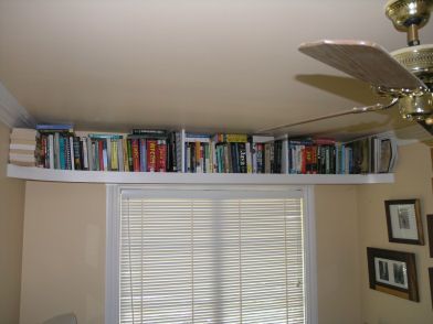 Book shelf above the window. Great for our tiny study! (Check the Bill Shelf at IKEA) Shelf Near Ceiling Bedroom, Single Book Shelf On Wall, Ceiling Bookshelf Wrap Around, Shelves From Ceiling, Hanging Glass Shelves, Doll Shelves, Shelf Above Window, Ceiling Bookshelf, Hallway Remodel