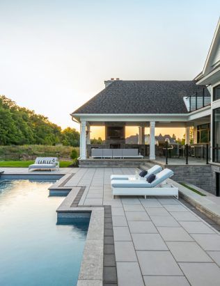 Modern Pool Pavers And Coping, Pavers Around Pool Landscape Design, Pool Coping And Decking Ideas, Pool Pavers Decking, Unilock Beacon Hill Smooth Opal, Paver Patio Around Pool, Patio To Pool Deck Transition, Paver Pool Deck Ideas, Unilock Beacon Hill Smooth