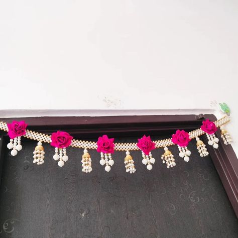 Pearl rose toran with jhumka pattern Size 38 to 40 inch approx Pack in plastic box 🎁 DM us for more details or WhatsApp us on 9867422790 Flower Toran, Mandir Decor, Wool Crafts Diy, Mantle Fireplace, Festival Aesthetic, Door Hanging Decorations, Pearl Crafts, Housewarming Decorations, Pooja Mandir