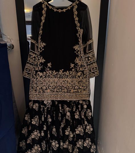 It’s all about black, a perfect wedding outfit for this upcoming wedding season Black formal outfit with zardozi work on shirt paired with embellished gharara and gotta finished silk dupatta For order and details please dm | visit kehkeshan.aamir | or whatsapp us on 03115693004 [ Kehkeshan kehkeshanz black gharara formal wedding wear laamofficial Pakistanifashion ] Black Garara, Black Formal Outfit, Black Gharara, Gharara Pakistani, Garara Dress, Long Skirt Top Designs, Simple Long Dress, Gharara Suits, Long Skirt And Top