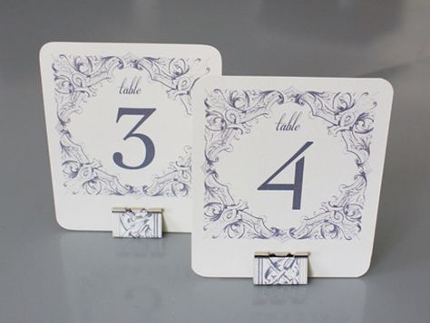 Printable table number templates with matching stands made from office binder clips. Diy Table Number Stands, Wedding Budget Template, Free Printable Wedding Invitations, Table Numbers Wedding Diy, Framed Table Numbers, Table Number Stands, Diy Table Numbers, Printable Table Numbers, Diy Wedding Table