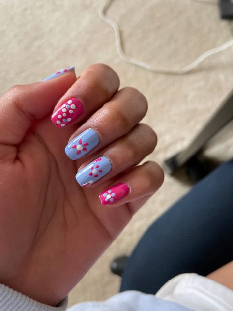 blue and pink nails with flowers Red Blue Flower Nails, Blue And Pink Flower Nails, Navy Blue Nails With Pink Flowers, Blue Flower Gel Nails, Pink Nails Blue Flowers, Blue Flower Manicure, Pink Flower Nails, Pink And Blue Flowers, Pastel Flowers