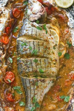 Whole baked Seabass with tomatoes , onions, garlic herbs and spices Cakes Animals, Recipes Pescatarian, Baked Sea Bass, Whole Fish Recipes, Sea Bass Recipes, Fish Salmon, How To Cook Fish, Fish Dinner, Salmon Fishing