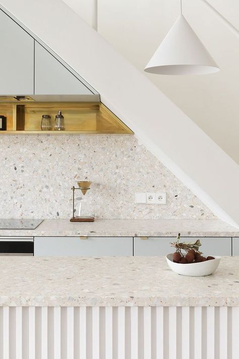 a serene white and pale blue kitchen with white terrazzo countertops and a backsplash, white pendant lamps Terrazzo Kitchen Countertops, Terrazzo Backsplash, Terrazzo Countertop, Terrazzo Kitchen, Flip House, French Interior Design, White Terrazzo, Parisian Apartment, Minimal Home