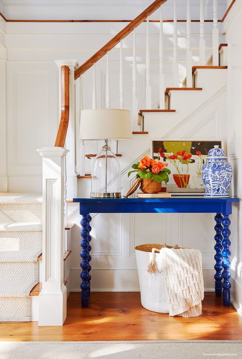 Nantucket Homes Interiors, Colorful Coastal Living Room, Nantucket Design, Nantucket Decor, White Sitting Room, Blue Console Table, Nantucket House, Nantucket Basket, White Round Tables