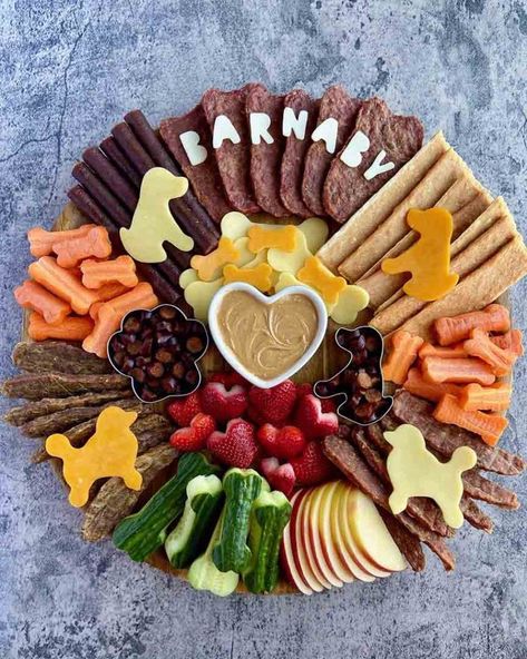 In honor of National Pet Day, I put together the barking cutest canine charcuterie board. When it comes to showering your dogs with treats and pampering them with belly rubs, there’s no such thing as going too far. The most… The post BarkCuterie: A Charcuterie Board for Dogs! appeared first on Ain't Too Proud To Meg. Charcuterie Board Ideas For Dogs, Puppy Birthday Ideas For Dogs, Puppy Decorations For Party, Charcuterie Board For Dogs, Puppy Party For Dogs, Dog Themed Charcuterie Board, Mexican Dog Party, Gotcha Day Photo Shoot Dog, Pawty Dog Party Food