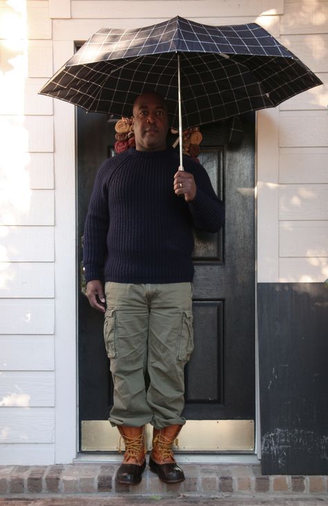 Me wearing L.L. Bean Duck Boots With a Blue Wool Sweater, Green Cargo Pants, and Holding a Black Umbrella. Ll Bean Duck Boots Outfit, Duck Boots Outfit, Ll Bean Duck Boots, Blue Wool Sweater, Men's Casual Outfits, Duck Shoes, Black Umbrella, Duck Boot, Classic Menswear