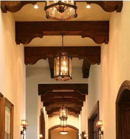 Beams and corbels in hallway Faux Beam Archway, Corbels In Hallway, Wooden Corbels Decor, Corbel Hallway, Ceiling Beams With Corbels, Hallway Ceiling Beams, Cover Beam Ideas, Spanish Corbels, Doorway Corbels