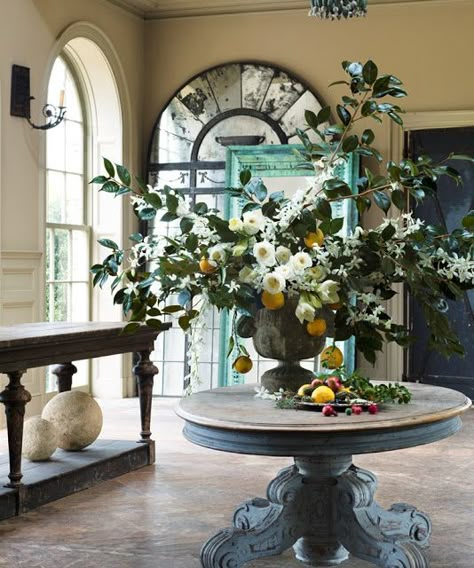 The Peak of Chic®: Veranda: The Romance of Flowers Fireplace Flowers, Round Foyer, Round Foyer Table, Round Entry Table, Winter Floral Arrangements, Veranda Magazine, Entryway Style, Beautiful Entryways, Floral Arranging