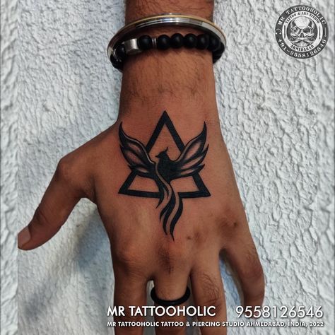 Mens Triangle Tattoo, Hand Phoenix Tattoo, Phoenix Triangle Tattoo, Pheonix Tattoo Ideas For Men, Back Hand Tattoo Men, Cool Small Tattoos For Men On Arm, Best Tattoos For Men Hand, Small Phoenix Tattoo Men, Phoenix Tattoo Men Arm