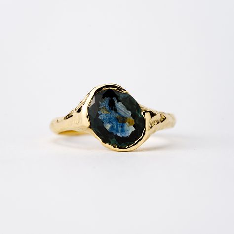 This lovely low-profile ring is set with a stunningly deep Blue Montana Sapphire with sparkle and a strong saturation of color. A lovely spready stone that sits low on the finger and feels like an even larger stone than it is. Metal: 18k Yellow Gold Stone: 2.12ct Montana Sapphire This ring was made using our proprietary Wood Casting technique, giving the ring all of it’s natural and individual texture. The Stone was hand cut in our Brooklyn studio following the natural shape of the rough sapphire. This is a genuinely one-of-a-kind piece. Montana Sapphire Ring, Montana Sapphire, Gold Stone, Natural Shapes, Deep Blue, Low Profile, Sapphire Ring, Montana, The Stone