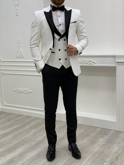 Tuxedos and Wedding Suits Collection Color Code: White Suit Material: 65% Polyester, 35% Viscose Not Machine Washable, Dry Clean Only. 1 Front Botton Hole Fitting: Slim Fit Drop 6 Italian Cut with1 Front Button Hole Delivery Time: 2-4 Business Days Via DHL Your Package Will Include: Jacket, Vest, Pants, Shirt, Bow Tie, Chain, and Flower. _________________________________ The model in the photo wears size EU48, His measurements are: Weight: 75kg = 165lbs Height: 1.80cm = 70.866 inches ------- EU4 Groom Suit White Tie, Black And White Suit For Men, White Suit Male, White Tuxedo Wedding, Mens White Suit, Man Dress Design, Tuxedo Colors, Wedding Kurta, Male Wedding