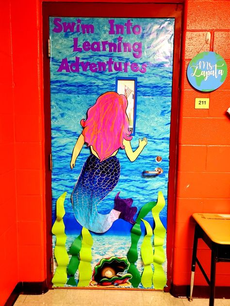 Mermaid classroom door Mermaid Classroom Door, Mermaid Door Decorations, Little Mermaid Classroom Theme, Little Mermaid Bulletin Board, Under The Sea Door Decorations Classroom, Mermaid Classroom Theme, Mermaid Classroom, Kindergarten Door, Little Mermaid Decorations