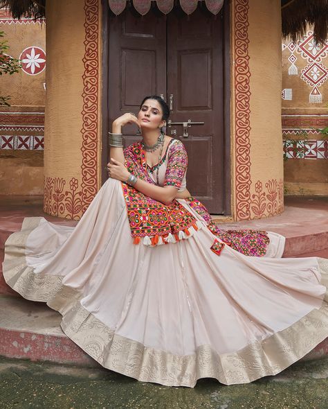 Add our natural beige color navratri lehenga in your wardrobe with viscose rayon chaniya with 7.5 meter flair and embroidery work with all over mirror blouse and beautiful dupatta 🤍⭐️ SHOP NOW 🛍️ gotifab.com [lehengacholi, garba outfits, navratri lehengas, navratri collection,navratri chaniya choli,navratri collection ] #lehengacholi #navratrilehenga #navratricollection #navratri #navratrichaniyacholi #garbaoutfit Punjabi Lehenga, Lehenga Top, Mirror Work Lehenga, Navratri Festival, Indian Skirt, Navratri Chaniya Choli, Lehenga Wedding, Indian Party Wear, Indian Lehenga