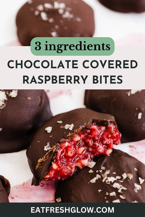 Chocolate raspberry bite cut in half to reveal filling with more bites surrounding. Raspberry Chia Chocolate Bites, Dark Chocolate And Fruit Healthy Snacks, Healthy Dessert Raspberry, Chocolate Raspberry Clusters, Frozen Raspberry Yogurt Bites, Raspberry Coconut Balls, Healthy Chocolate Covered Fruit, Chocolate Covered Raspberry Bites, Raspberry Chocolate Bars