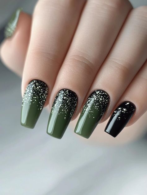 This enchanting manicure features a sophisticated gradient design combining olive green and black polish with a cascading silver glitter effect that resembles falling stardust. The square-shaped nails showcase a beautiful transition from solid colors at the base to a concentrated sparkle at the tips, with three nails in olive green and one accent nail in classic black. This celestial-inspired design is perfect for those who love glamorous yet...