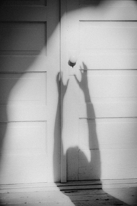 I like how they have chosen this door to use in the photo, it looks decaying and old to match the creepy shadow Hand Shadows, Shadow Silhouette, Shadow Photography, Little Miss Sunshine, Photo Composition, Shadow Art, Shadow Play, White Photos, The Shadow