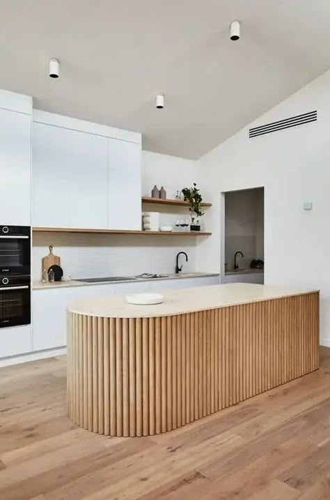 Picture of a white minimalist kitchen with a neutral stone countertop, a curved fluted kitchen island and open shelves Flat Panel Kitchen Cabinets, Panel Kitchen Cabinets, Curved Kitchen Island, Curved Kitchen, Kitchen Island Bench, Neutral Kitchen, Minimalist Kitchen Design, Kitchen Benches, House Design Kitchen