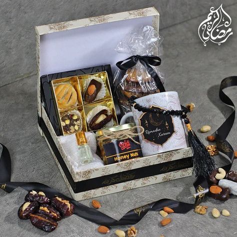 A stylish off-white boxed set with premium treats and Ramadan essentials. 4 Pcs Assorted Dates Box4 Pcs Chocolate Chip Cookies1 Pc Honey Nuts Jar1 x Attar1 x Tasbih1 x Topi1 x Ramadan Theme Mug This Includes: • Free Delivery• Free Greeting Card DisclaimerThe product may vary slightly from the picture shown.Prices are inclusive of all taxes. Ramadan Essentials, Ramadan Theme, Honey Nut, Free Greeting Cards, Boxed Set, Ramadan Mubarak, White Box, Gift Hampers, Chocolate Chip