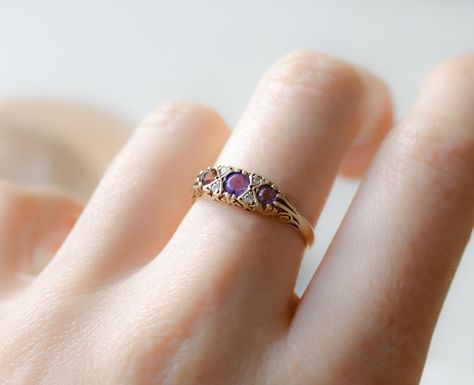 ✨ New Arrival! ✨ Add a touch of classic elegance to your collection with this exquisite 9ct gold amethyst and diamond ring. 💍 Crafted in 1988, it features three vibrant amethyst stones, sparkling with small diamond accents. Weighing 2.2 grams and sized UK P 1/2 (US 7.75, EU 56), this ring boasts a timeless design perfect for any occasion. #VintageJewelry #AmethystRing #GoldJewelry #ClassicElegance #MyGoldenFinds Amethyst And Diamond Ring, Amethyst Stones, Amethyst Stone, Amethyst Ring, Classic Elegance, New Arrival, Timeless Design, Diamond Ring, Gold Jewelry