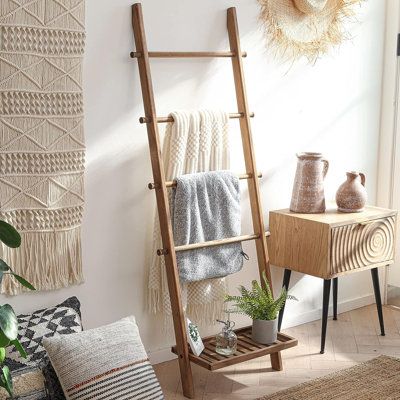 Crafted with skill and care by experienced artisans, this ladder is meticulously fashioned from 100% solid wood. Its robust construction makes it a reliable choice for hanging towels, blankets, throws, newspapers, and even light strings. | Loon Peak 5Ft Rustic Farmhouse Wooden Blanket Ladder w/ Bottom Shelf: Decorative Wall-Leaning Towel Rack | C100317981 | Wayfair Canada Ladder Hanger, Wood Blanket Ladder, Wooden Blanket Ladder, Blanket Holder, Bathroom Basement, Blanket Rack, Vintage Ladder, Quilt Display, Rustic Ladder