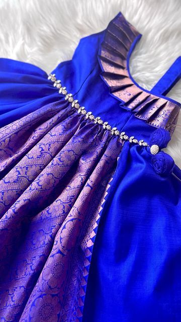 Little Pattu (Toronto, Canada) shared a post on Instagram: "Royal Blue with champagne boarder gorgeously coordinated and accessorized in to a gorgeous evening kanchipuram one shoulder dress! This can be made in any colour of your choice". Follow their account to see 1869 posts. Cotton Frocks For Kids, Frocks For Kids, Kids Party Wear Dresses, Model Blouse, Kids Party Wear, Kids Dress Collection, Kids Blouse Designs, Baby Frock Pattern