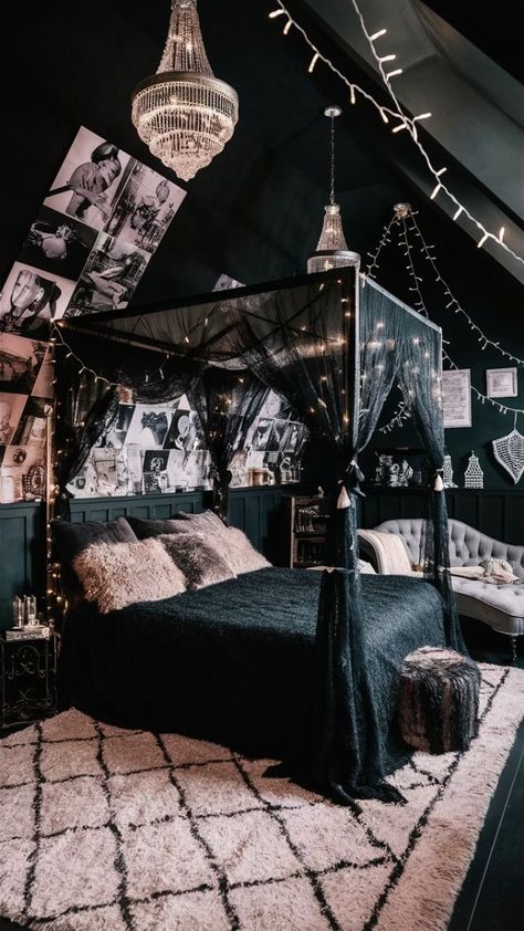 A captivating photo of a stylish boho-chic black bedroom. The room features a canopied bed adorned with a black lace canopy and fluffy pillows, surrounded by fairy lights. The walls are adorned with a mix of black and white photography, adding a vintage touch. A plush rug with a Moroccan-inspired pattern lies beneath the bed, creating a warm and inviting atmosphere. The room is enhanced by the presence of an ornate chandelier, more fairy lights, and a cozy reading nook with a chaise lounge., photo Black Fairy Lights Bedroom, Goth Boho Bedroom, Black Canopy Bedroom Ideas, Canopy Bed Aesthetic, Grey Boho Bedroom, Moody Boho Bedroom, Witch Bedroom, Ornate Chandelier, Lace Canopy