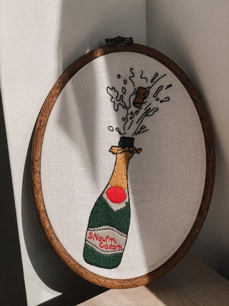 #newyear#champagne#happynewyear#cheers#embroideryhoopart#embroiderydesign#finishedembroidery#embroideryinhoop#wallhangingembroidery#handmadeembroidery#handstitched#madeonorder#nurgehoop#stitches Bottle Embroidery, New Year Is Coming, Champagne Pop, Embroidery Inspiration, Champagne Bottle, Hand Stitching, Hand Embroidery, Decorative Tray, Champagne