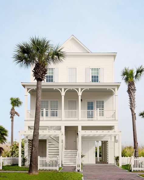 “I love the very soft blue we chose for the shutters,” says Anne Grandinetti, senior designer and creative director of Mark Ashby Design. “It’s just a slight contrast from the white exterior.” Cozy Window Nook, Florida Beach Cottage, Beachside Bungalow, Galveston Beach, Cottage Porch, Beach Bungalow, Galveston Texas, Pretty Beach, Beach Bungalows