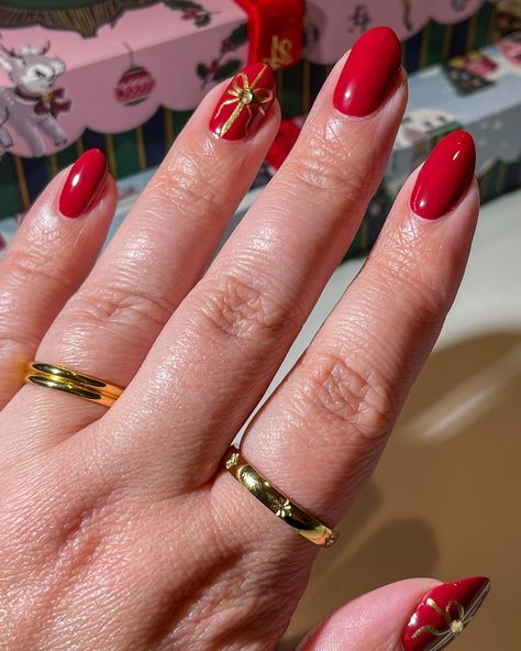 Present nail art 🎁 with the new @lightslacquer holiday collection, available today! Use my code MAGICAL for 10% off! ✨ @lightslacquer Red Ribbons @lightslacquer Baby It’s Gold Outside @lightslacquer Cocktail Hour Charms (all gifted) Nail inspo, holiday nails, Christmas nail art, holiday nail designs, winter nails, red and gold nails, bow nails, coquette holiday nails, coquette aesthetic, nail inspiration, nail polish, new in beauty, gift ideas for women, gift ideas for her, Lights Lacquer,... Red Nails With Gold Bow, Present Nail Art, Red And Gold Nail Art, Holiday Nail Designs Winter, Red Nails With Gold, Nails Red And Gold, Present Nails, Winter Holiday Nails, Winter Nails Red