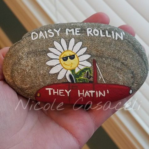 DAISY me rollin', they hatin' Daisy "ridin" song pun rock  #paintedrocks #kindnessrocks #artistsofinstagram #artistsoninstagram #rockart #rockartist #pebbleart #stoneart #paintedrocksofinstagram  #rockpainting #freeart #paintedstones #ipaintrocks #daisybrigade Pun Painted Rocks, Funny Painted Rock Sayings, Funny Rock Art, Rock Painting Funny, Funny Painted Rocks, Funny Rock Painting Ideas, Funny Rock Painting, Positive Rocks, Positivity Rocks