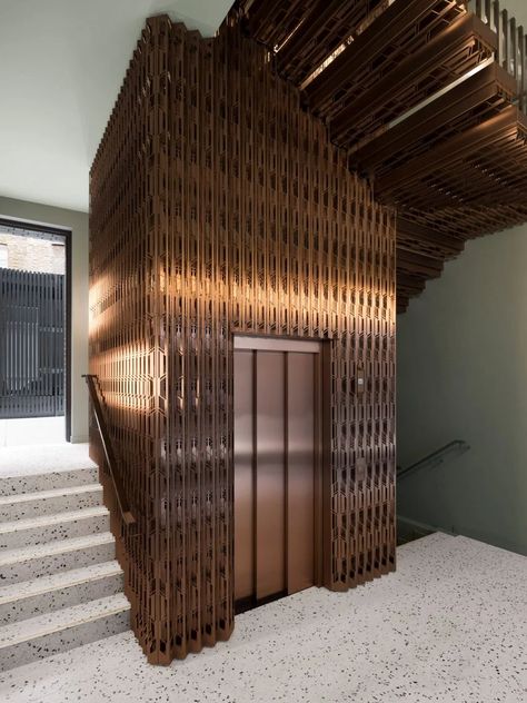 Bureau de Change inserts bronze lift into 1920s art deco office block Panoramic Lift, Public Amenities, Art Deco Office, Lift Lobby, Elevator Lobby, Wooden Panelling, Elevator Design, Timber Panelling, Lift Design