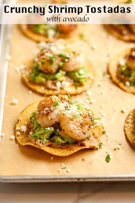 Crunchy Shrimp Tostadas combine crunchy tostada shells with layers of homemade refried beans, mashed avocado, and grilled shrimp. This Tex-Mex recipe is both easy to make and utterly delicious. Try it for Taco Tuesday or any day of the week! Shrimp Tostadas, Mexican Quinoa Salad, Fancy Appetizer Recipes, Homemade Refried Beans, Fancy Appetizers, Homemade Bread Recipes Easy, Mashed Avocado, Tex Mex Recipes, Weeknight Dinner Recipe