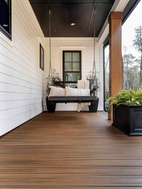 Pictures of the HGTV Smart Home 2022 Front Yard | HGTV Smart Home 2022 | HGTV Farmhouse Modern Front Porch, White House With Wood Accents Exterior, Front Yard Farmhouse, Composite Front Porch, Front Porch Ceiling Ideas, Front Porch Modern Farmhouse, Hgtv Smart Home 2022, Front Porch Remodel, White Farmhouse Exterior