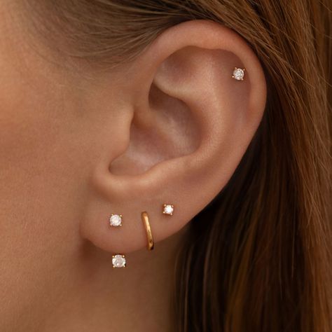 Achieve the look of double or stacked lobe piercings—no extra piercing required! The Crystal Ear Jacket is a versatile earring. Featuring a dazzling main stud, this clever design includes an adjustable back with three placement options to perfectly fit your lobe. Simply slide the stud through your piercing, adjust the backing for your ideal fit, and secure it with the butterfly clasp.  Why You’ll Love It:  Stacked Style, Simplified: Creates the illusion of multiple piercings with just one.  Custom Fit: Adjustable back ensures a snug, comfortable fit for any lobe size.  Everyday Elegance: Sleek crystal design adds a touch of sparkle to any outfit.  Size & Materials:  Adjustable 18 Carat Gold Plated Sterling Silver All sterling silver jewellery will tarnish (oxidise) over time as this is the Three Lobe Earring Stack, Stacked Lobe, Ear Lobe Piercings, Gold Ear Jacket, Lobe Piercings, Multiple Piercings, Corporate Chic, Lobe Piercing, Everyday Elegance