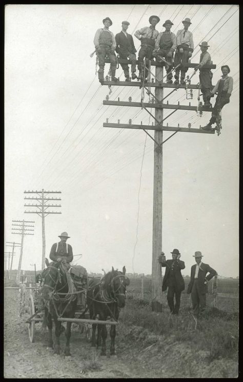 Construction workers standing atop a telegraph pole circa 1890-1910 Camper Decorations, Iron Workers, Power Lineman, Missoula Montana, Power Lines, Glass Insulators, Old Phone, The Old Days, A Town