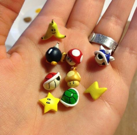 Mario Kart Items :) Mario Clay Charms, Super Mario Clay Sculptures, Polymer Clay Super Mario, Mario Clay Art, Gamer Clay Ideas, Super Mario Clay Art, Clay Mario Characters, Nintendo Clay Ideas, Mario Clay Ideas