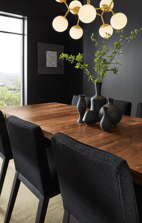 Dining room with Adams extension table, Ansel side chairs and Cosma chandelier. Dark Moody Dining Room, Moody Dining Room Ideas, Moody Dining Room, Dark Dining Room, Dining Room Decor Ideas, Christmas Dining Table Decor, Brown Dining Table, Wood Dining Room Table, Interesting Interiors