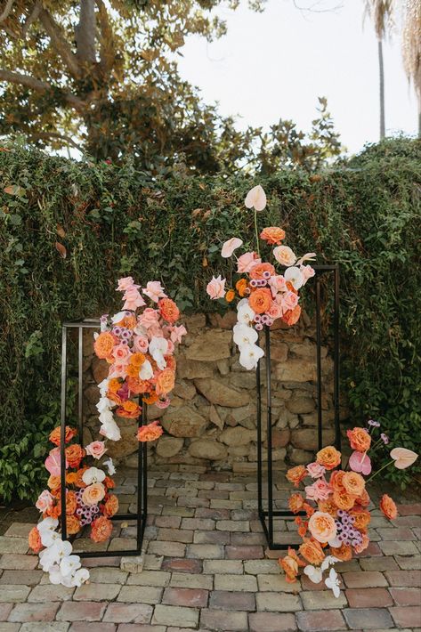 Fun & modern asymmetrical stands as wedding arch with bright florals by New Creations Flower Co, San Diego wedding florist; (Briana Nolan photo) Floral Arch Alternative, Floral Statement Pieces Wedding, Floral Backdrops For Weddings, Asymmetrical Arbor Flowers, Column Ceremony Decor, Backdrop Flowers Wedding, Flower Alter Wedding Floral Arch, 2024 Wedding Arch Trends, How To Make Flower Arch Wedding