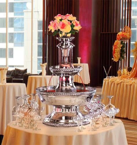 Champagne Fountain #Glamour Contact ABC Rentals to rent a fountain for your holiday party! #HolidayPartyDecorations Wine Fountain Wedding, Champagne Fountain Wedding, Bacchanalia Party, Punch Fountain, 1920s Party Theme, Drink Fountain, Wedding Punch, Fountain Wedding, Honeymoon Shower