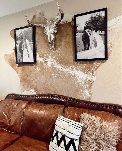 Cowhide Throw Pillows On Couch, Cowhide Wall Decor Bedroom, Boho Picture Collage Wall, Cowhide Hung On Wall, Western Home Wall Decor, Cowhide Hanging On Wall, Elk Hide Decor Ideas, Western Corner Decor, Steer Skull Decor Living Rooms