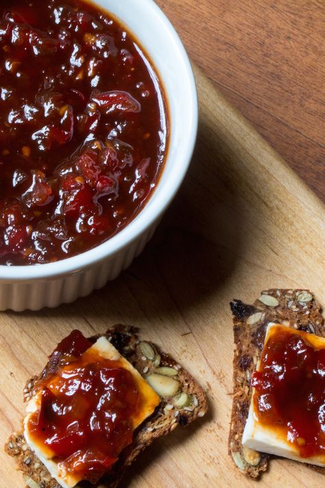 Red peppers, tomatoes, garlic, and onions all come together in this spicy red pepper jam. Red Pepper Jam, Spicy Jam, Savory Jam, Pepper Jam, Tomato Jam, Jam And Jelly, Jams And Jellies, Jelly Recipes, Turkey Burgers