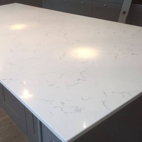 White Carrara Quartz Countertop Carrara Quartz Countertops, Countertop Decor Kitchen, Quartz Kitchen Countertops White, White Carrara Quartz, Leathered Granite Countertops, Laundry Room Decorating, Tile Countertops Kitchen, Kitchen Design Countertops, Quartz Bathroom