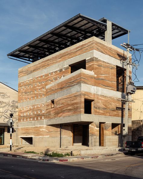 "Shifting shades" of rammed earth define Chonburi Multi-Purpose Building Sawtooth Roof, Rammed Earth Homes, Rammed Earth Wall, Sustainable Building, Public Architecture, Rammed Earth, Landscape And Urbanism, Chicago Architecture, Earth Homes